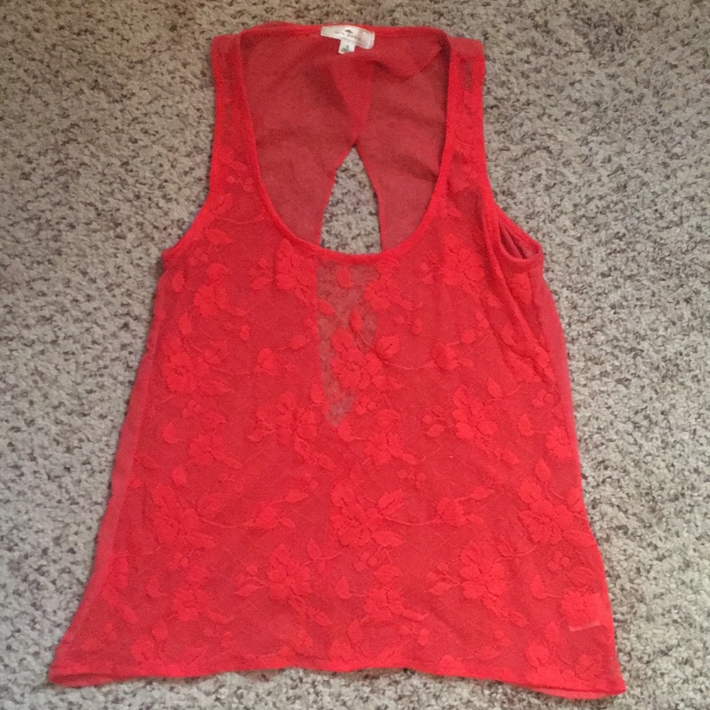 Orange floral see through tank top with back slit.